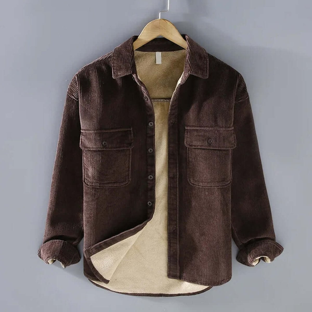 Brown corduroy shacket with cosy fleece lining, hanging open