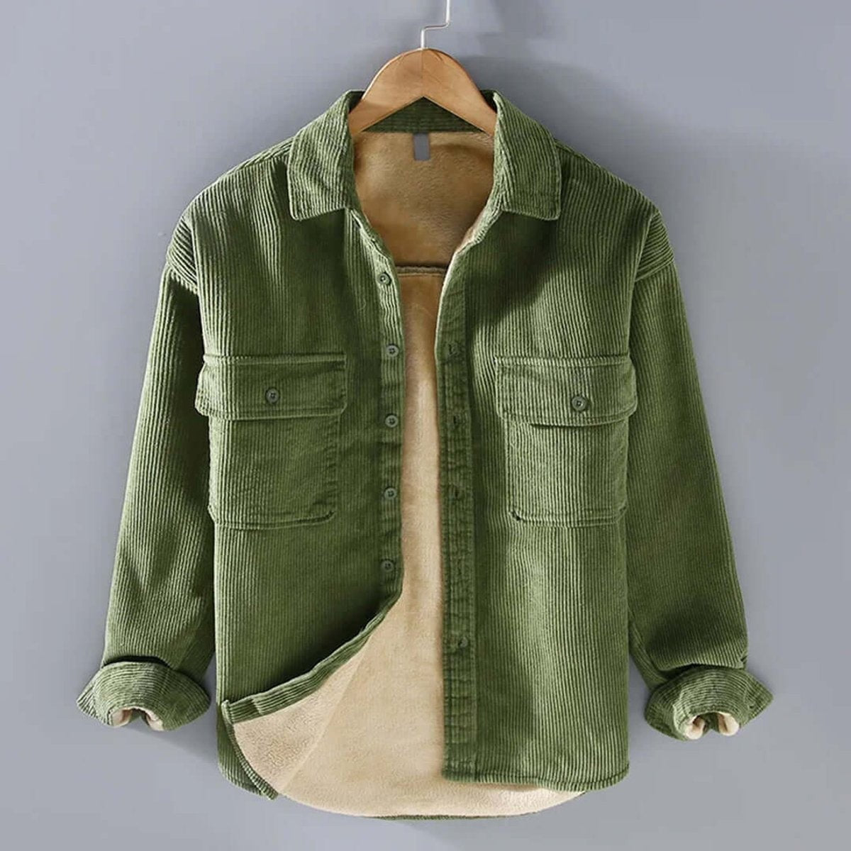 Olive green corduroy overshirt with fleece-lined interior and flap pockets