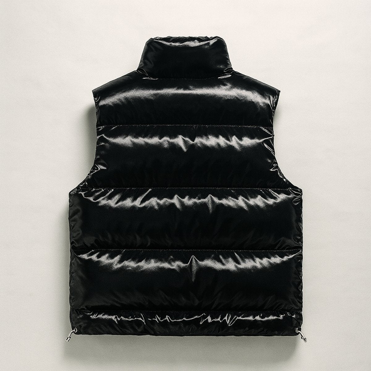 Rear view of black glossy quilted puffer vest