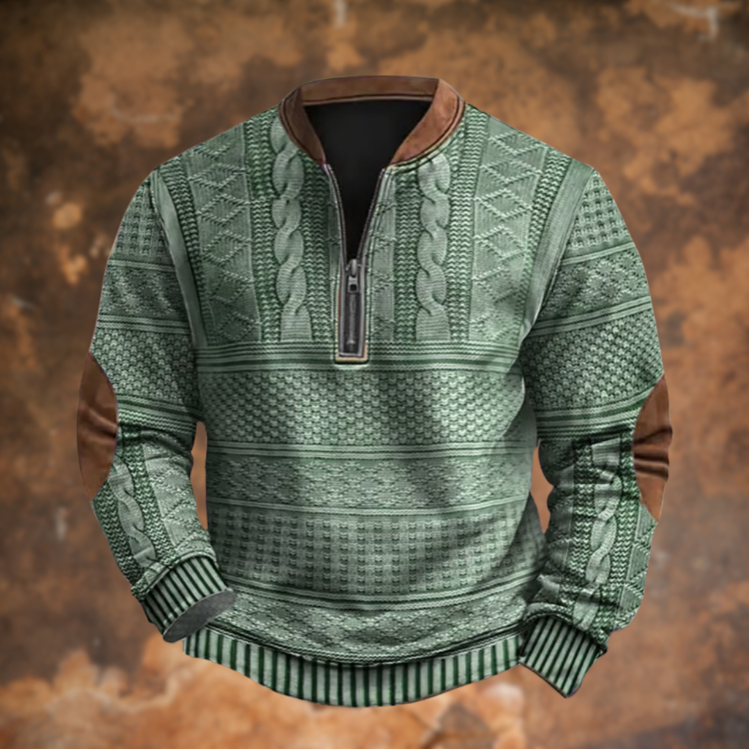 Sage green cable-knit jumper with brown suede trim and striped cuffs