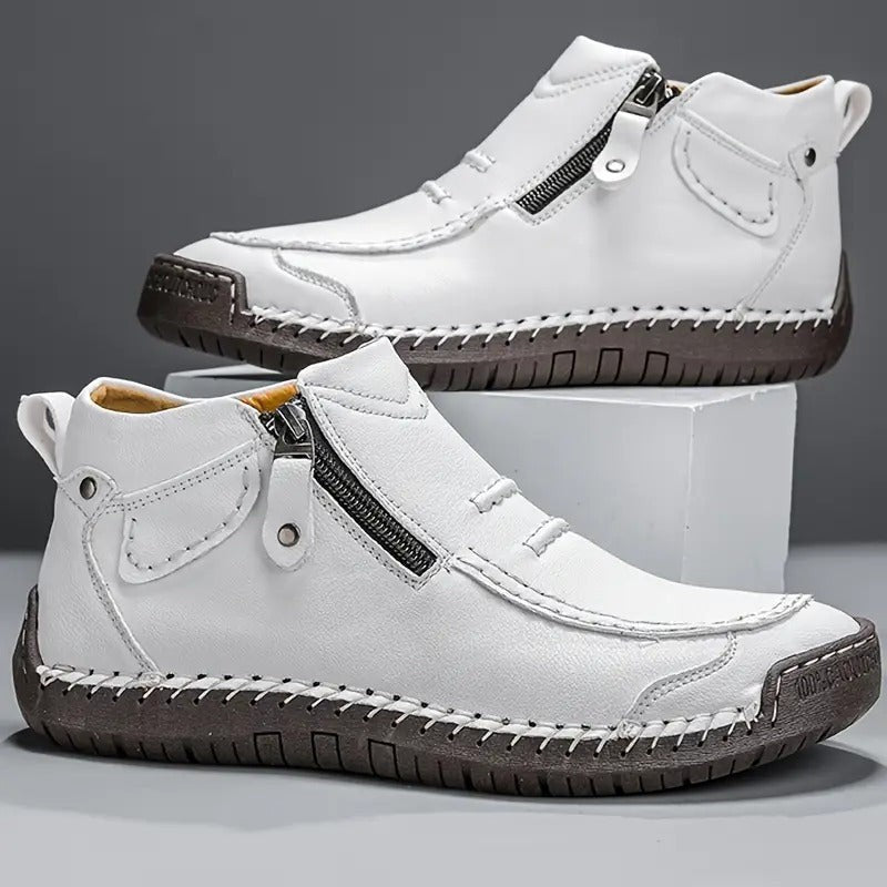 White leather ankle boots with side zip and hand-stitched sole