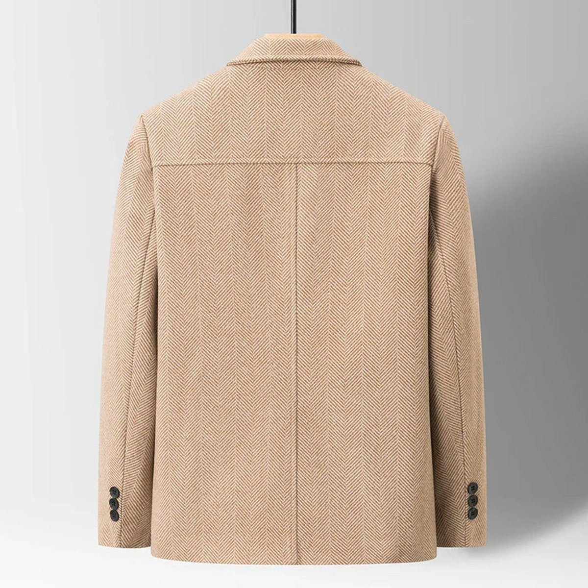 Rear view of camel herringbone wool-blend jacket showing tailored back seam
