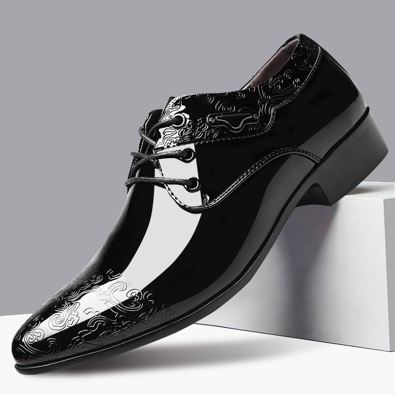 Black patent leather derby shoe with embossed swirl pattern and pointed toe