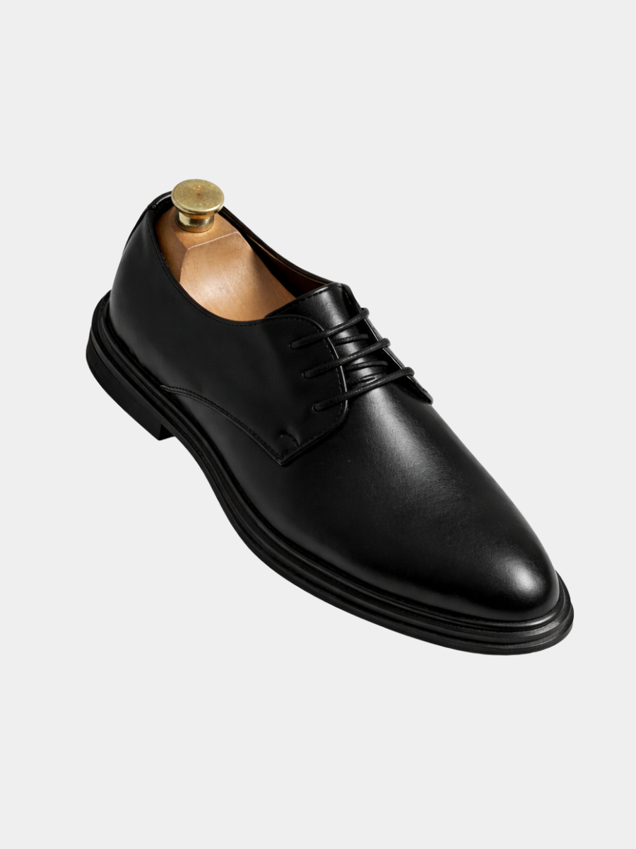 Black leather men's Derby shoe shown on wooden shoe tree with laces