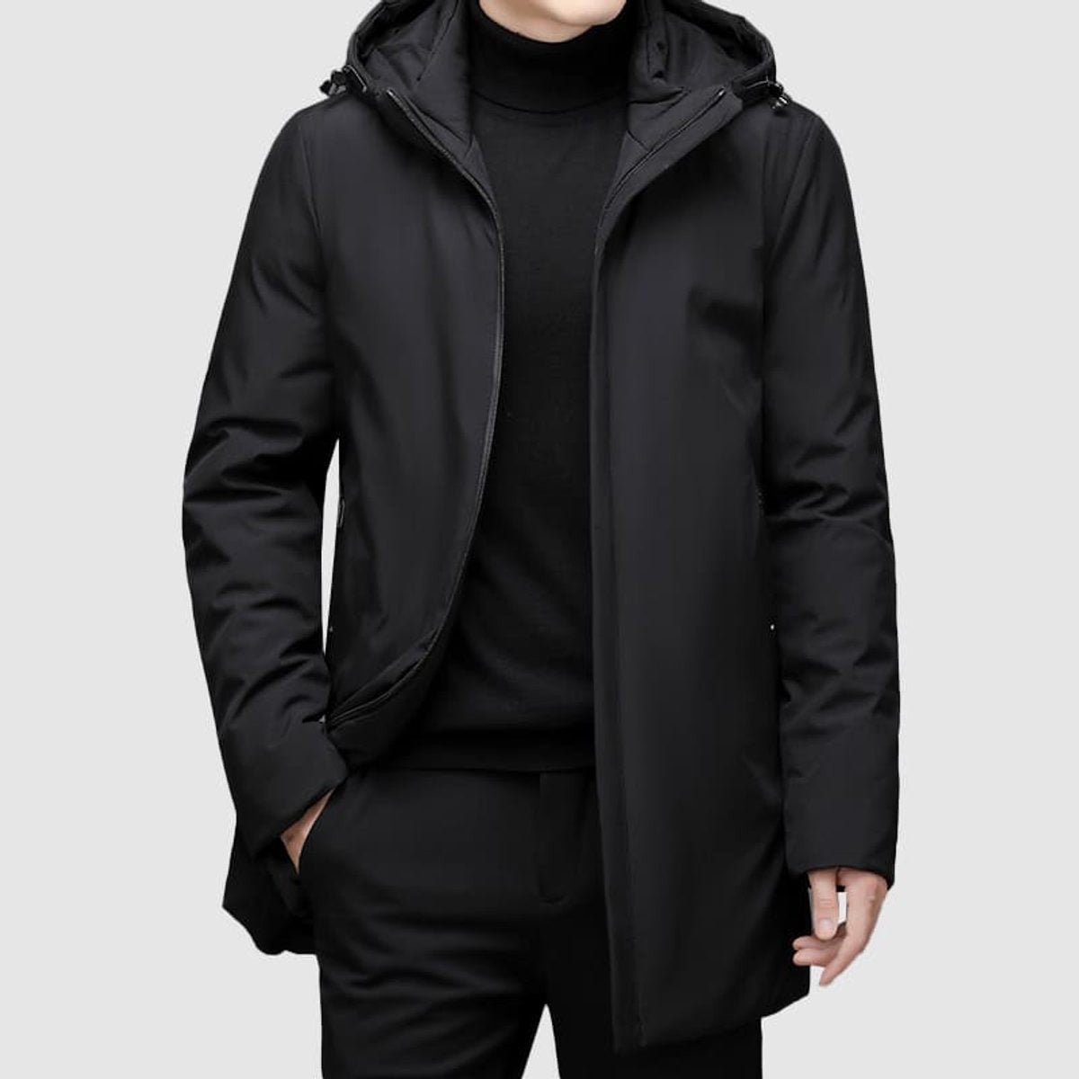 Black hooded waterproof coat with zip fastening and side pockets