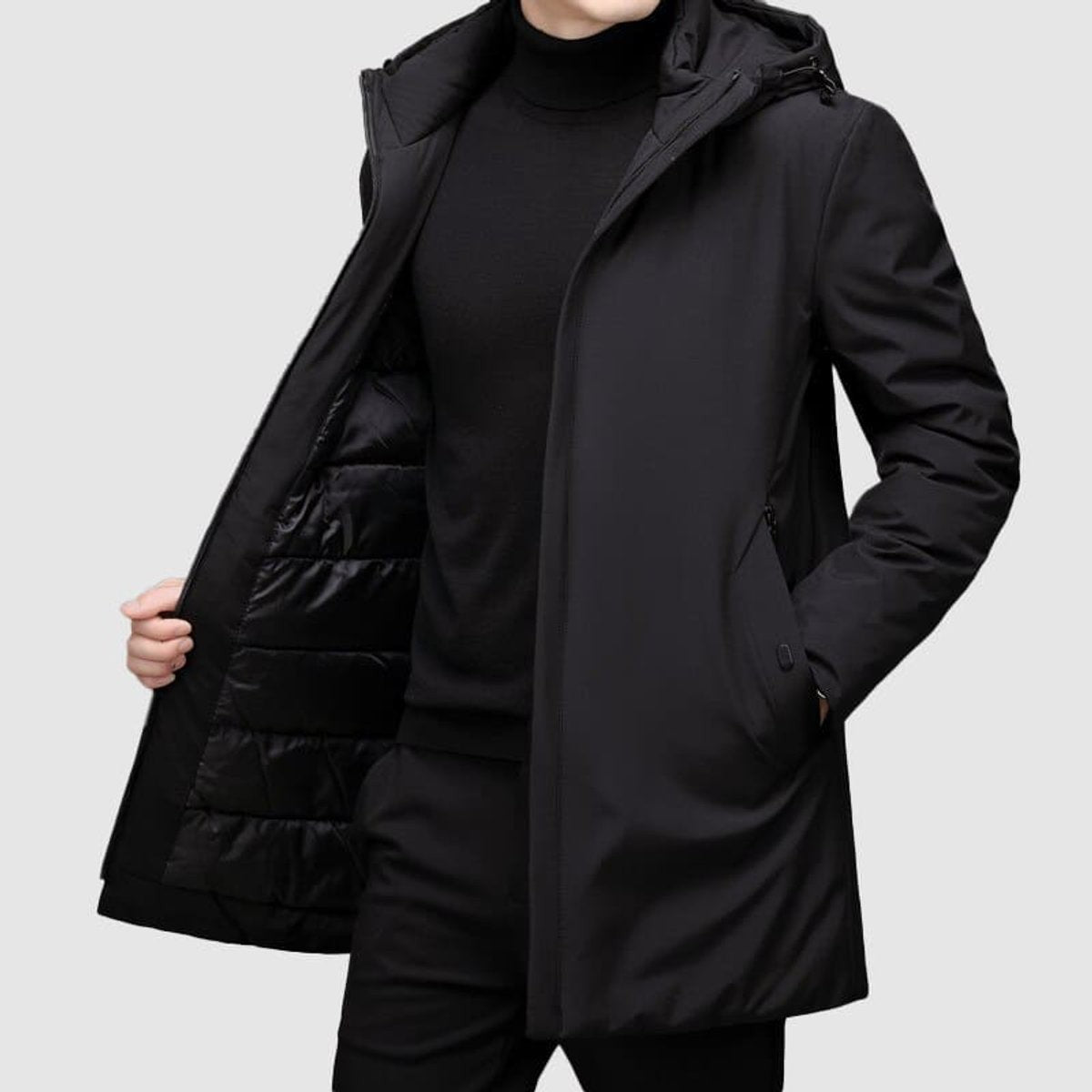 Black insulated parka showing quilted lining and hidden pocket detail