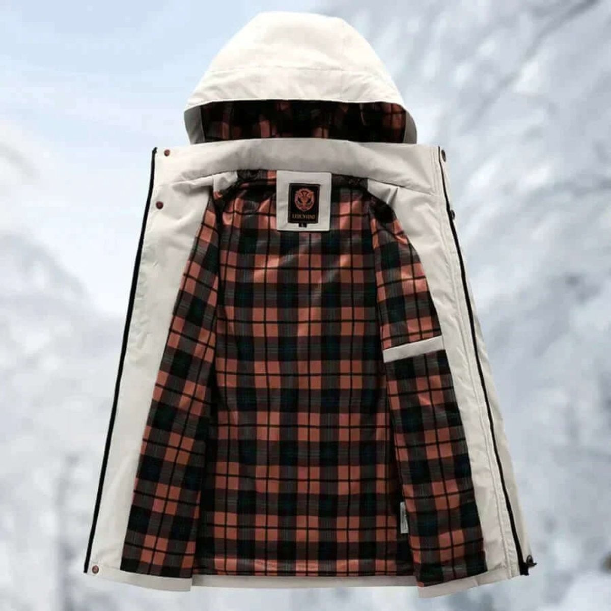 Stone jacket unzipped revealing tartan check inner lining and hood