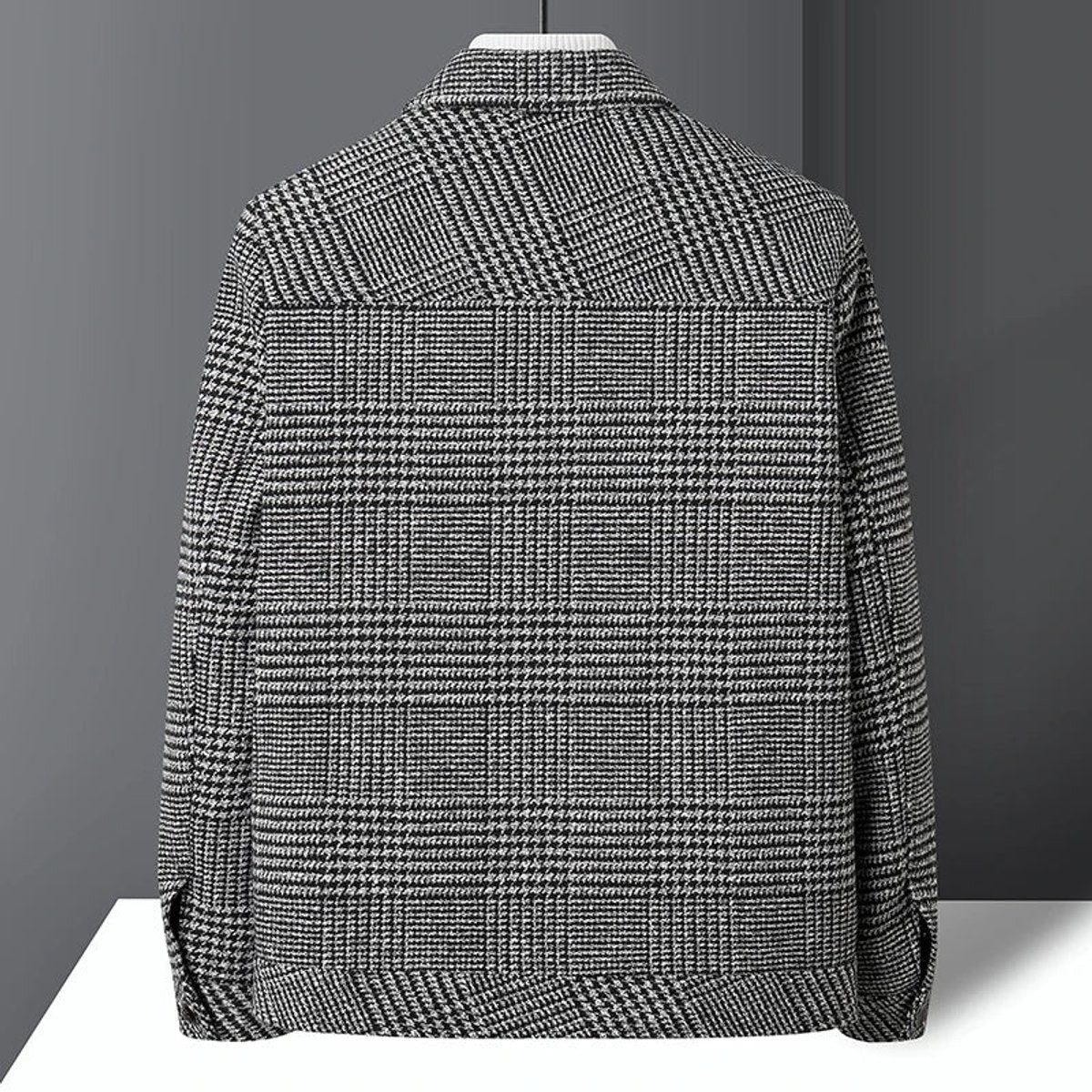 Rear view of grey check wool-blend jacket showing tailored back panelling