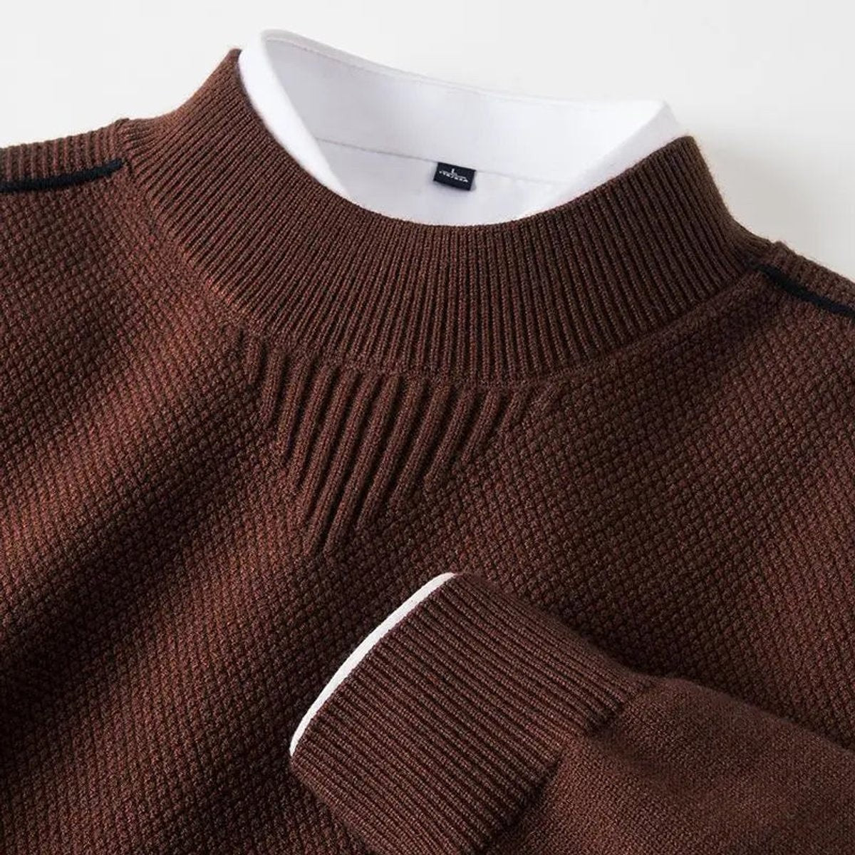 Brown ribbed mock-neck pullover featuring textured knit and contrast collar