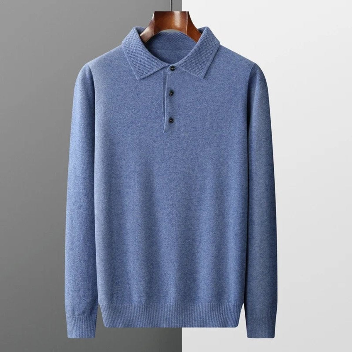 Blue knitted polo jumper hanging with textured collar detail