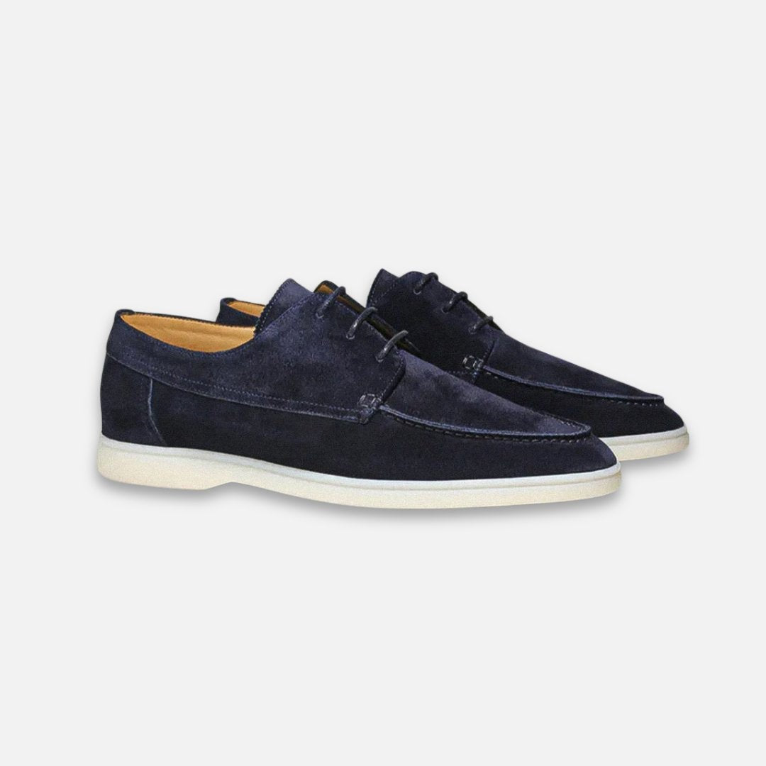 Navy suede lace-up derby loafers with moc-toe stitching and white sole