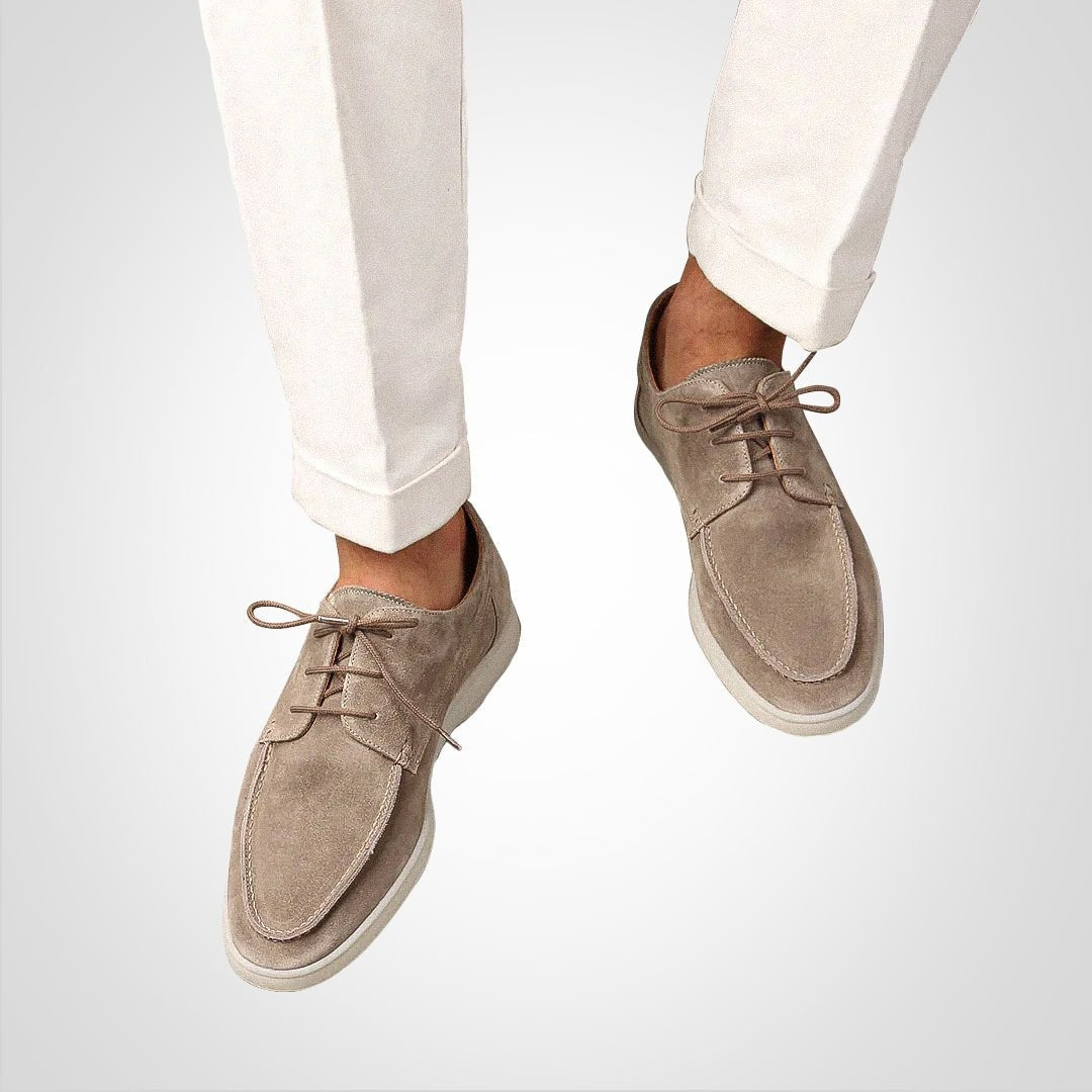 Man wearing taupe suede hybrid boat derby loafers with cream trousers