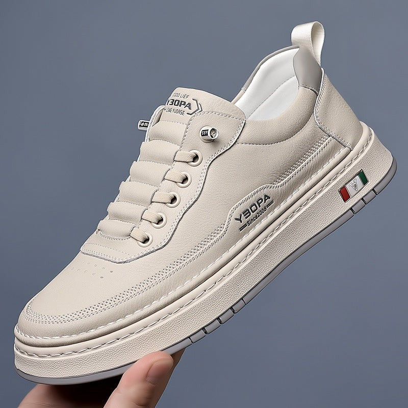 Camel leather trainer worn on foot, close-up side angle