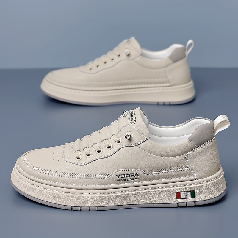 Cream leather trainer angled to show elastic lacing detail