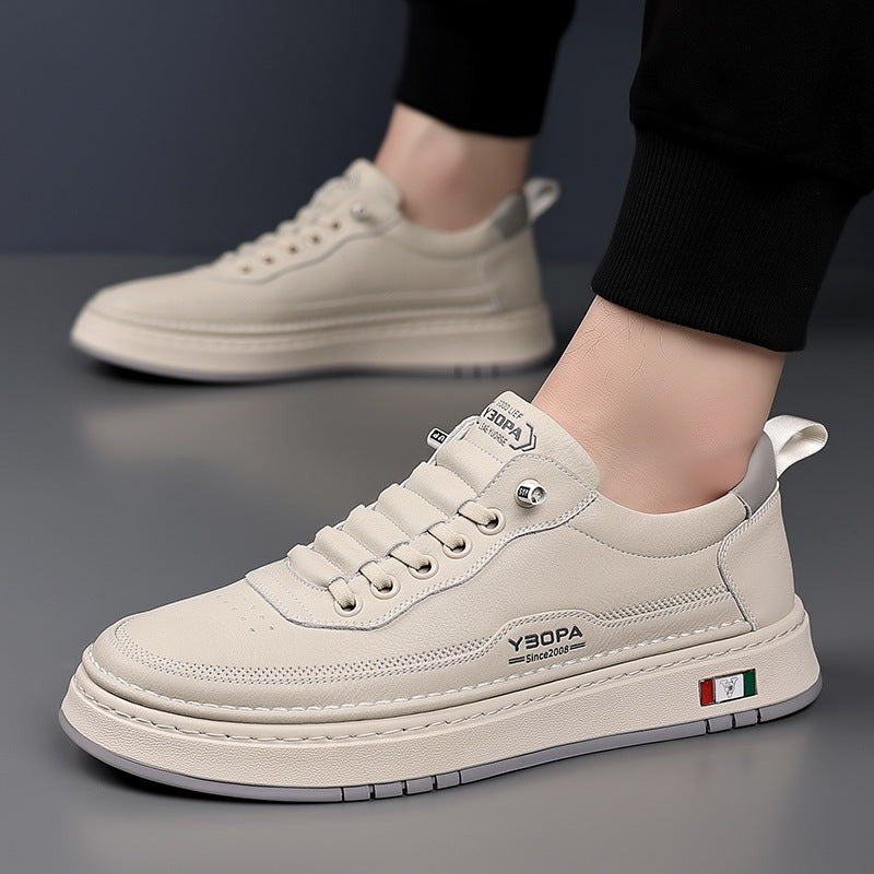 Cream leather trainer with grey heel tab, side profile view