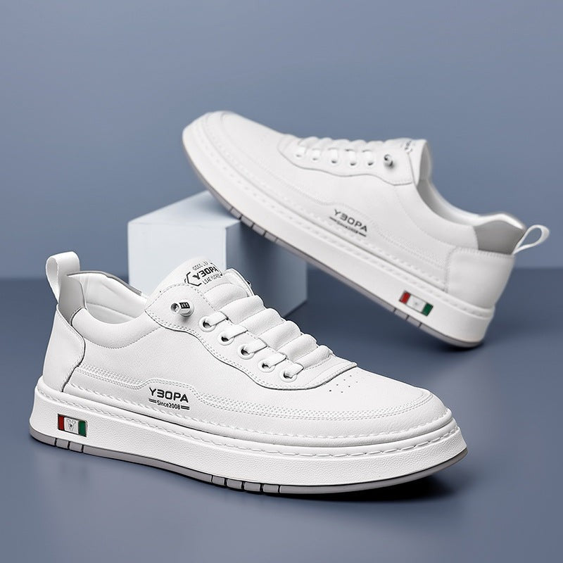 Cream leather trainers shown together, one held by hand