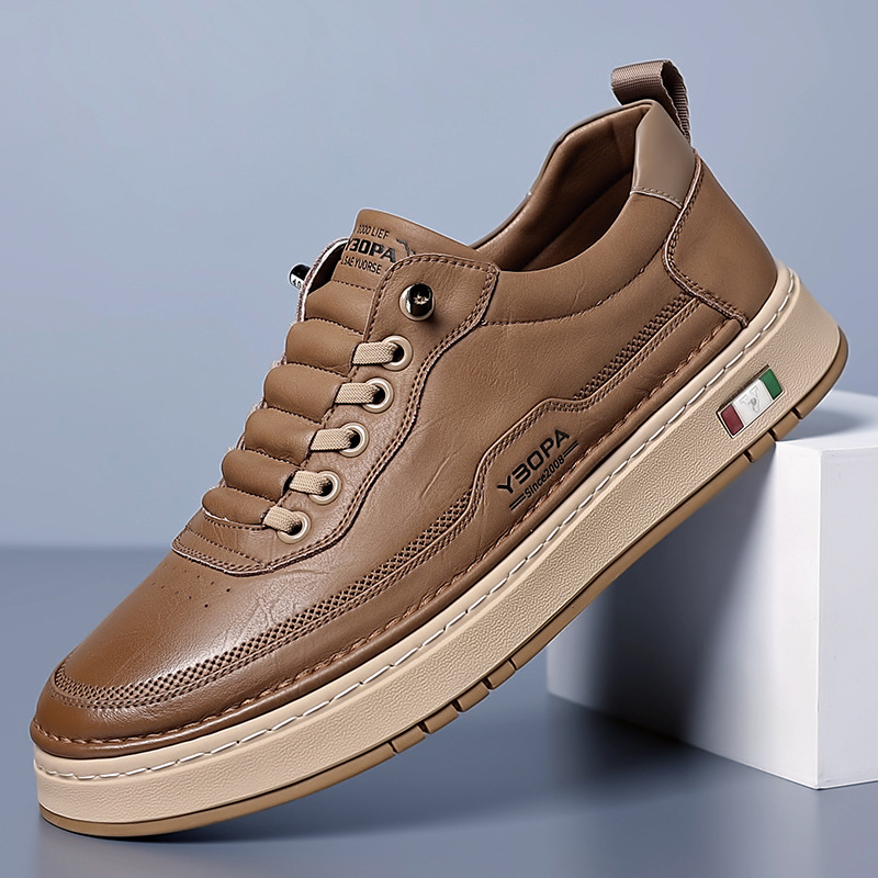 Tan leather lace-up trainer with beige platform sole, angled view