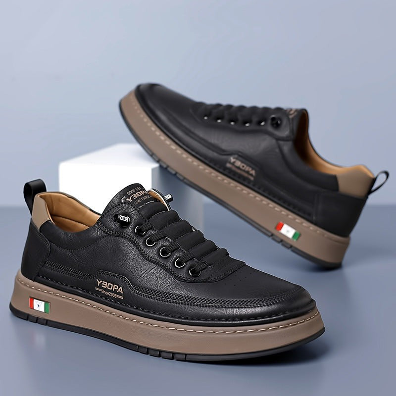 White leather trainer modelled on foot, side angle view