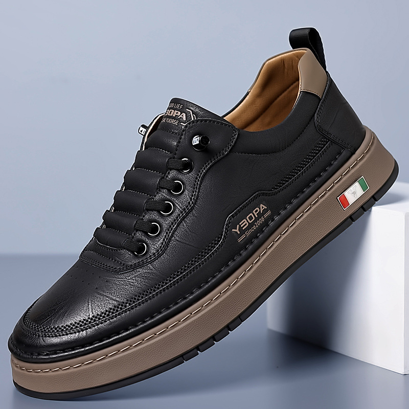 Black leather trainer with contrasting tan platform sole