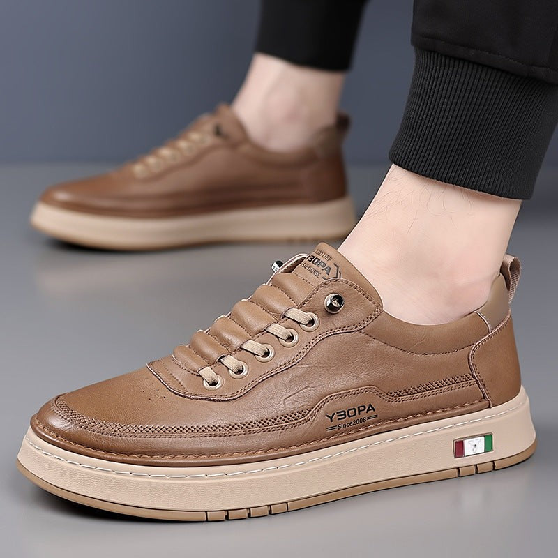 Tan leather trainer modelled on foot with cropped trousers