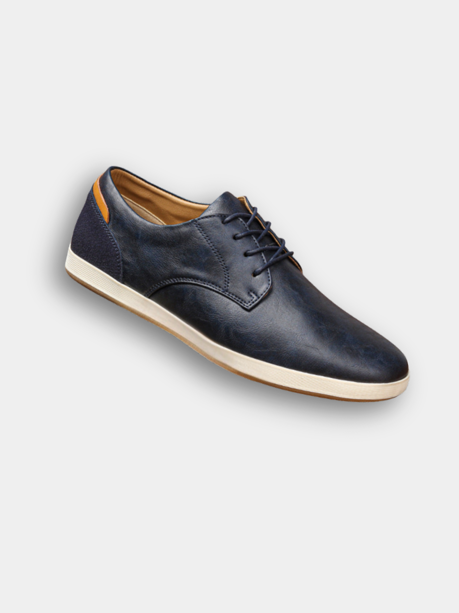 Navy leather lace-up trainers with contrasting white sole and suede heel panel