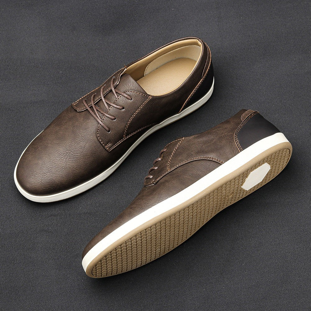 Dark brown leather lace-up trainers with black heel panel and white sole