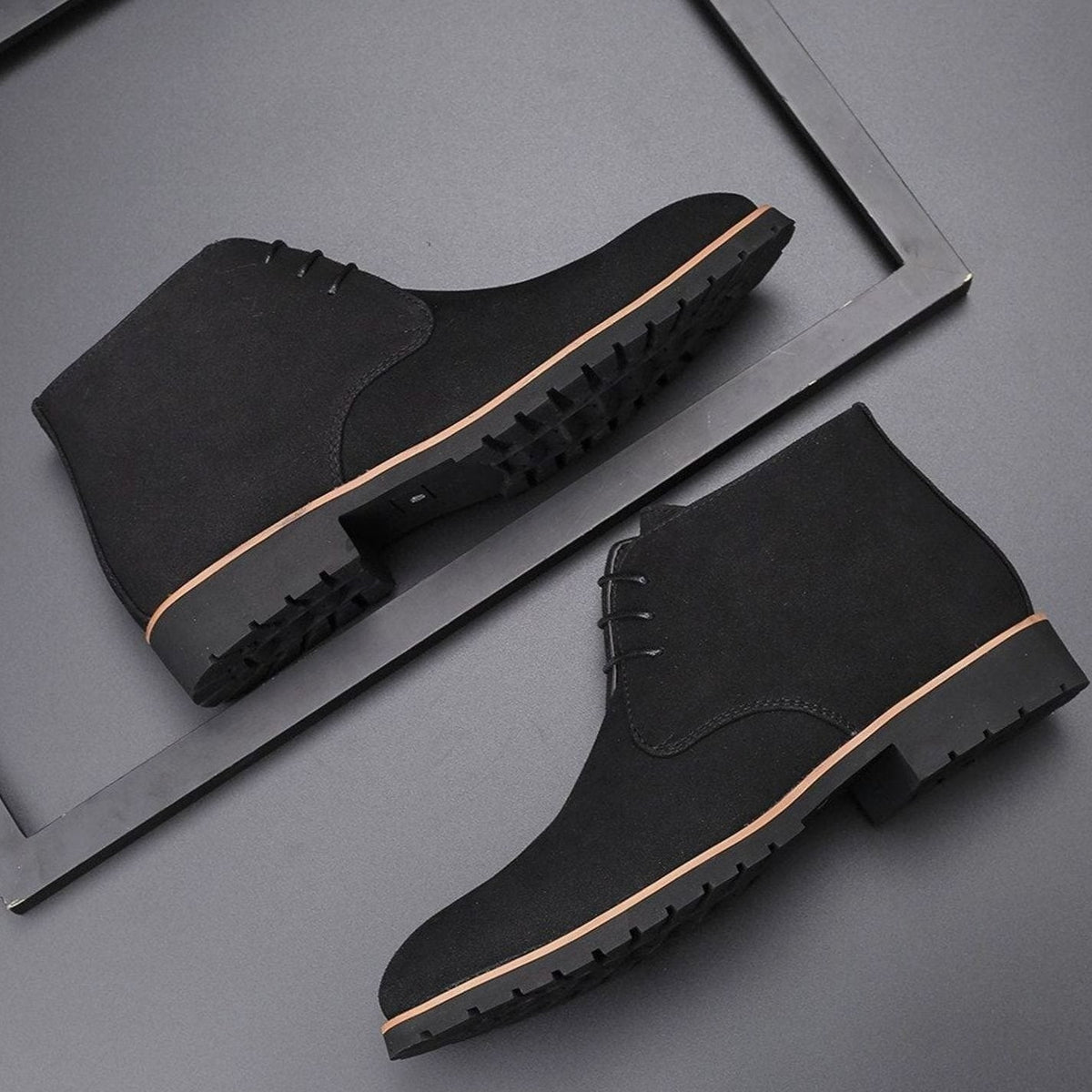 Black suede lace-up ankle boots with contrast tan welt and ridged sole