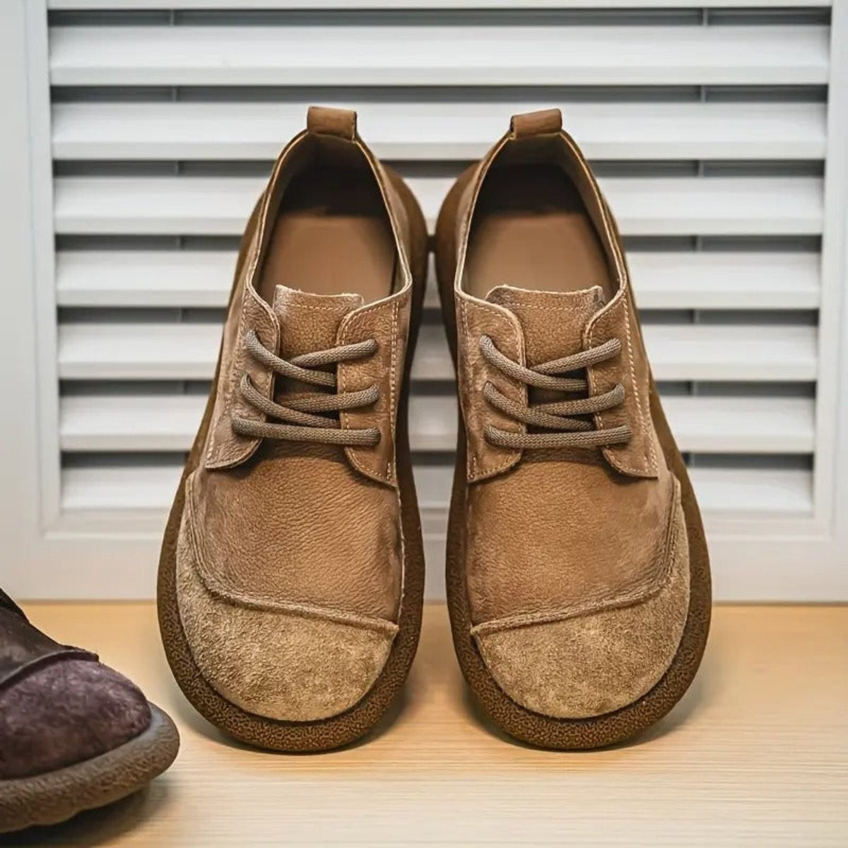Tan leather lace-up shoes with suede toe cap and chunky sole