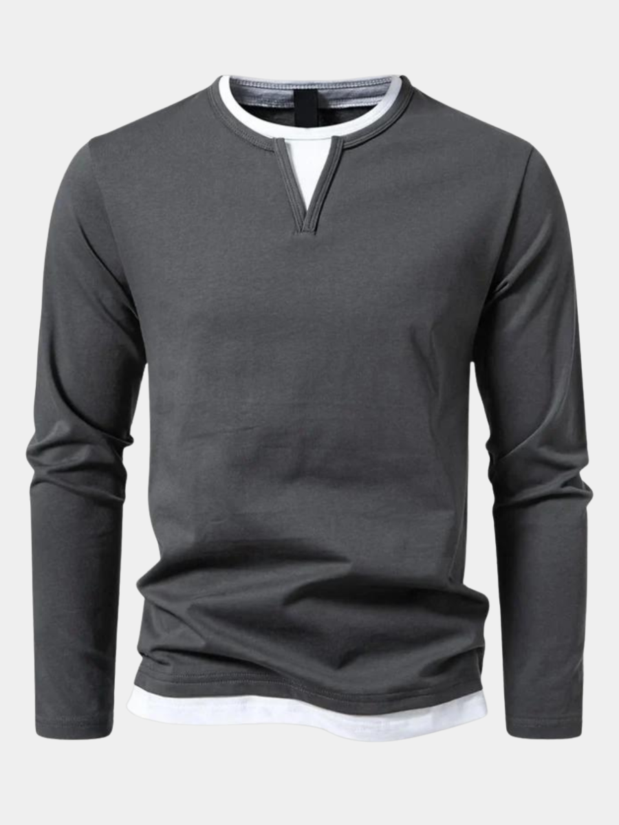 Charcoal grey long-sleeve top with layered white notch neckline detail