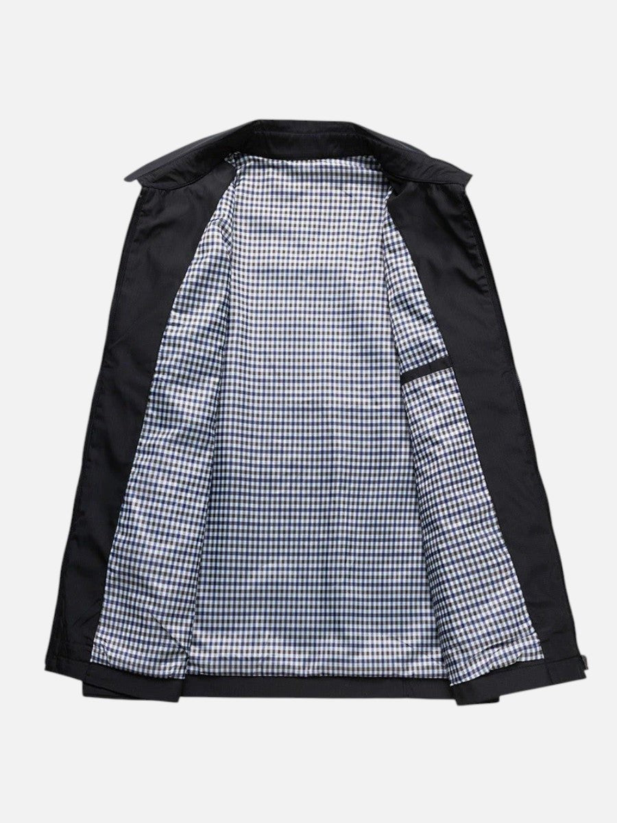 Black bomber jacket unzipped showing blue gingham check lining
