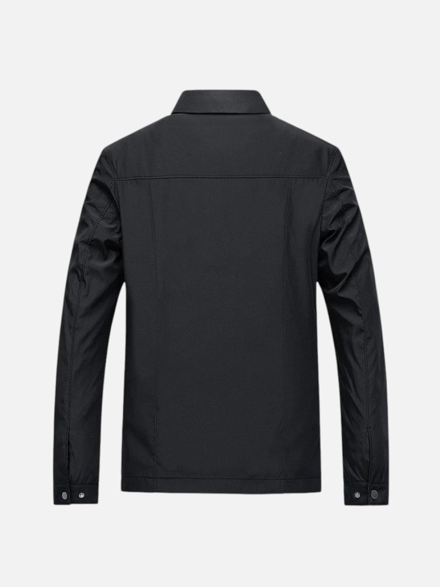 Black bomber jacket rear view showing shoulder seams and popper cuffs