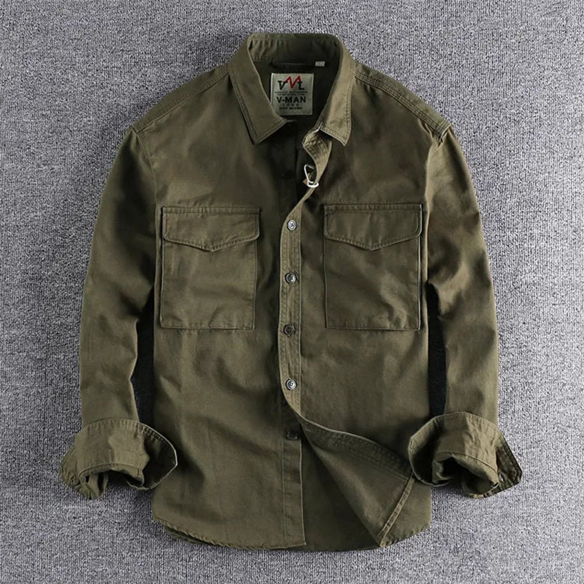 Olive green cotton military shirt with double chest pockets and button-up front