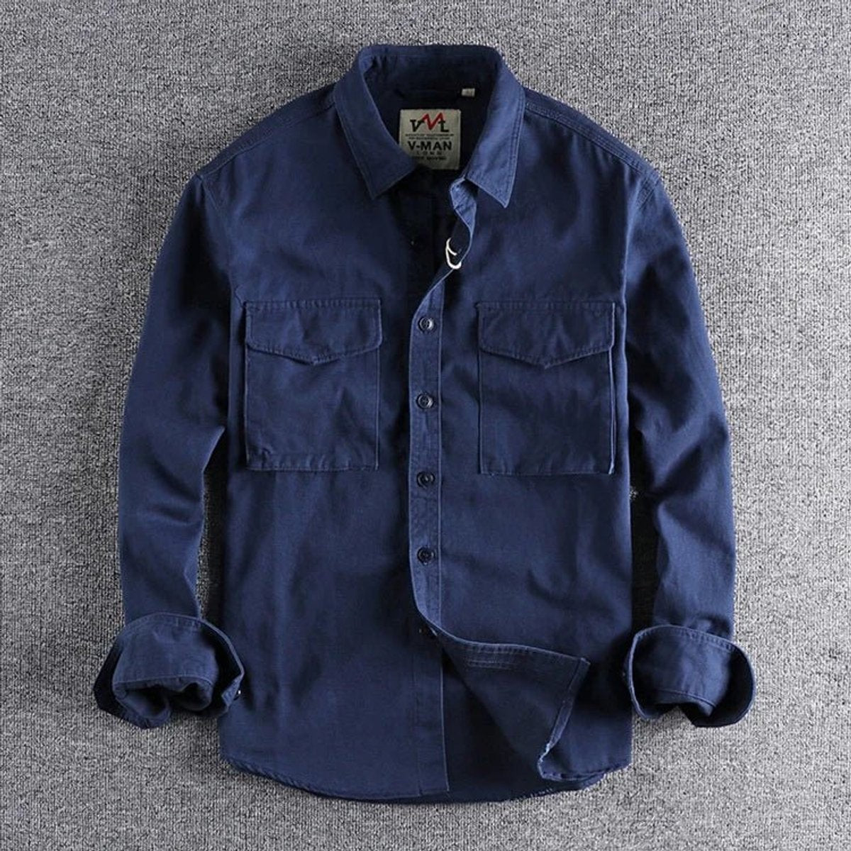 Navy cotton button-up shirt with double chest pockets and military-style collar