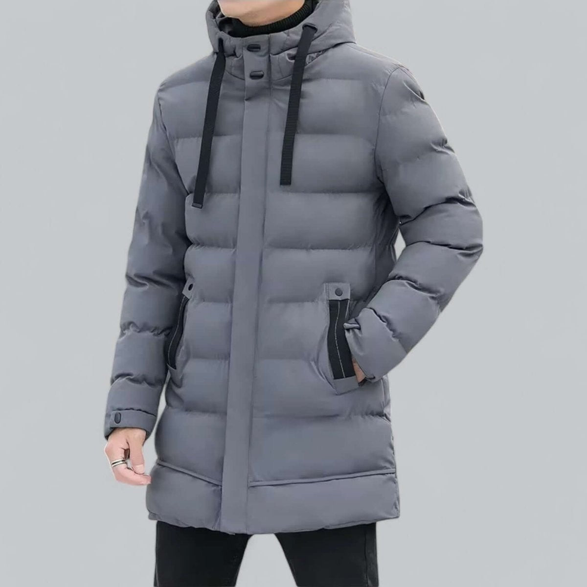 Grey longline hooded padded parka with drawstring hood on model