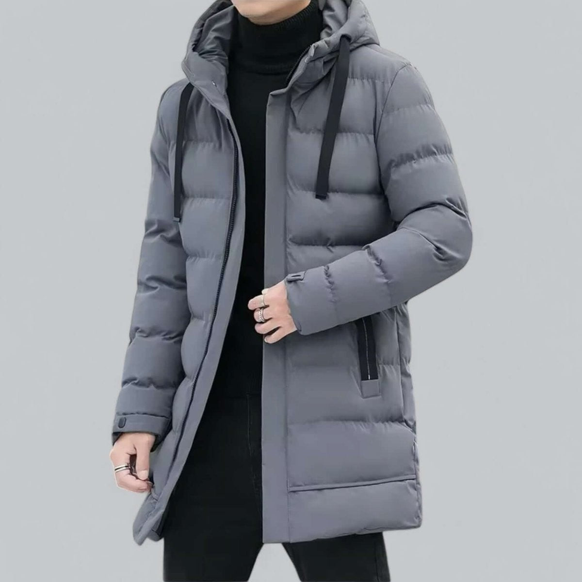 Men's grey hooded puffer parka with zip fastening, close view