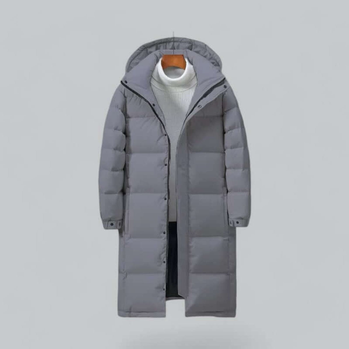 Grey hooded longline padded parka on hanger, zip and popper fastening