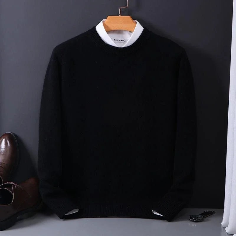 Black ribbed jumper with white collar peeking above neckline