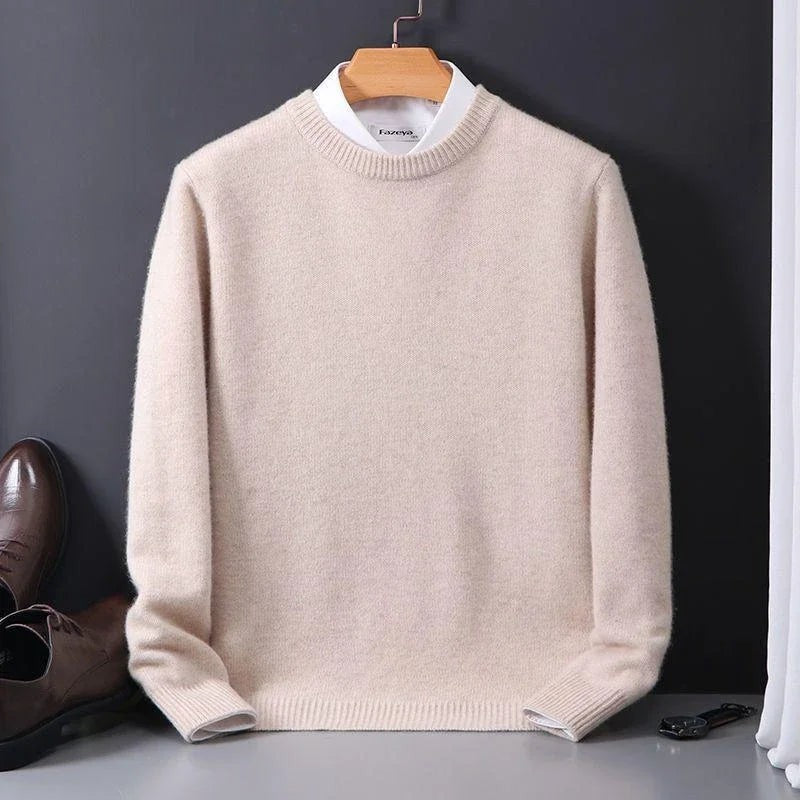 Cream mock-neck jumper paired with white shirt and brogues