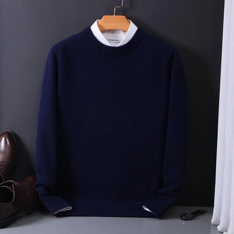 Navy mock-neck jumper hung with white collared shirt underneath