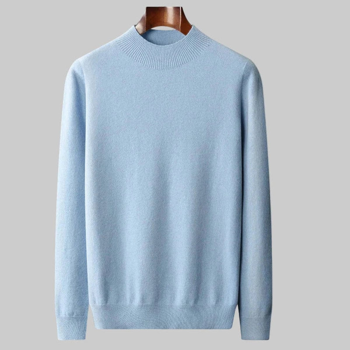 Pale blue half-neck cashmere blend jumper displayed on a wooden hanger