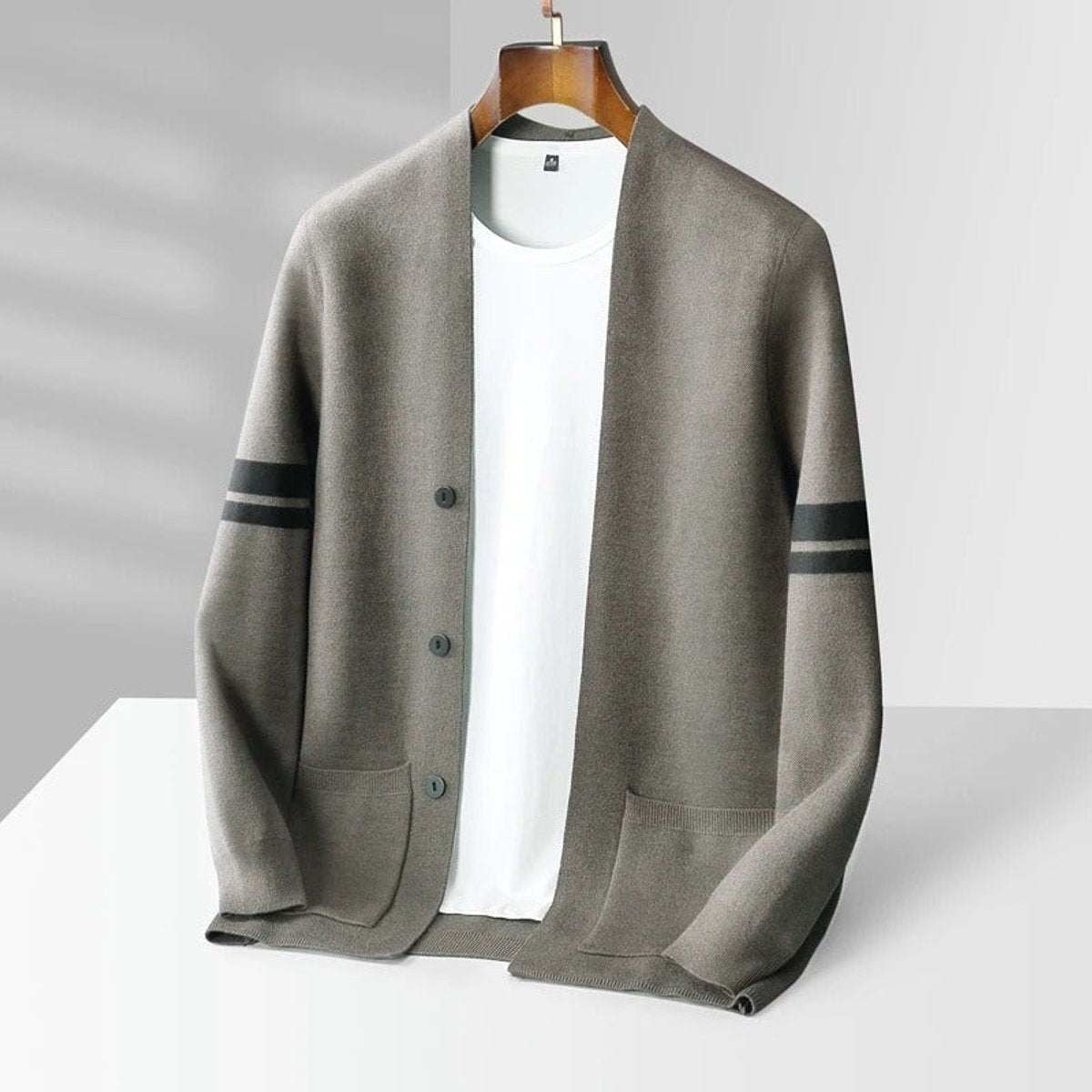 Khaki knitted cardigan with subtle dark stripes and buttoned patch pockets