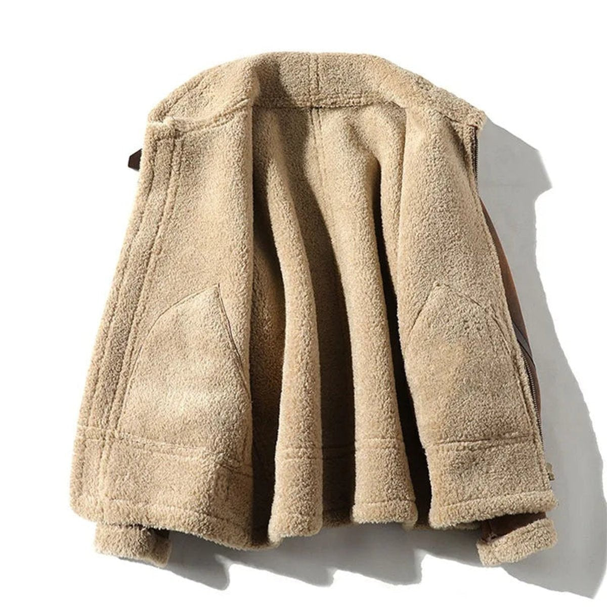 cream shearling lining visible inside brown suede aviator jacket, laid flat