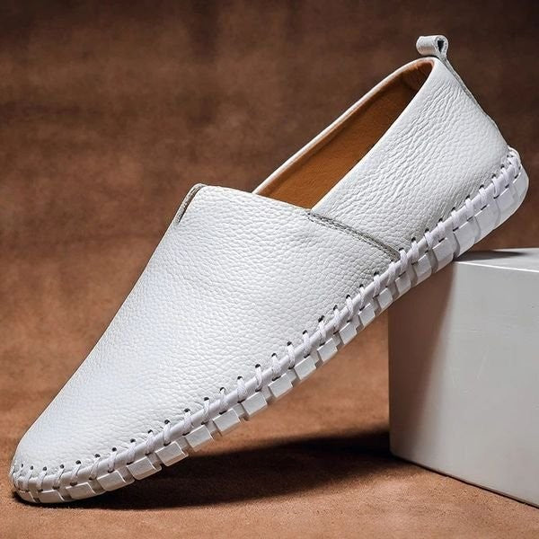 White pebbled-grain leather loafers with matching whipstitch detailing and round toe