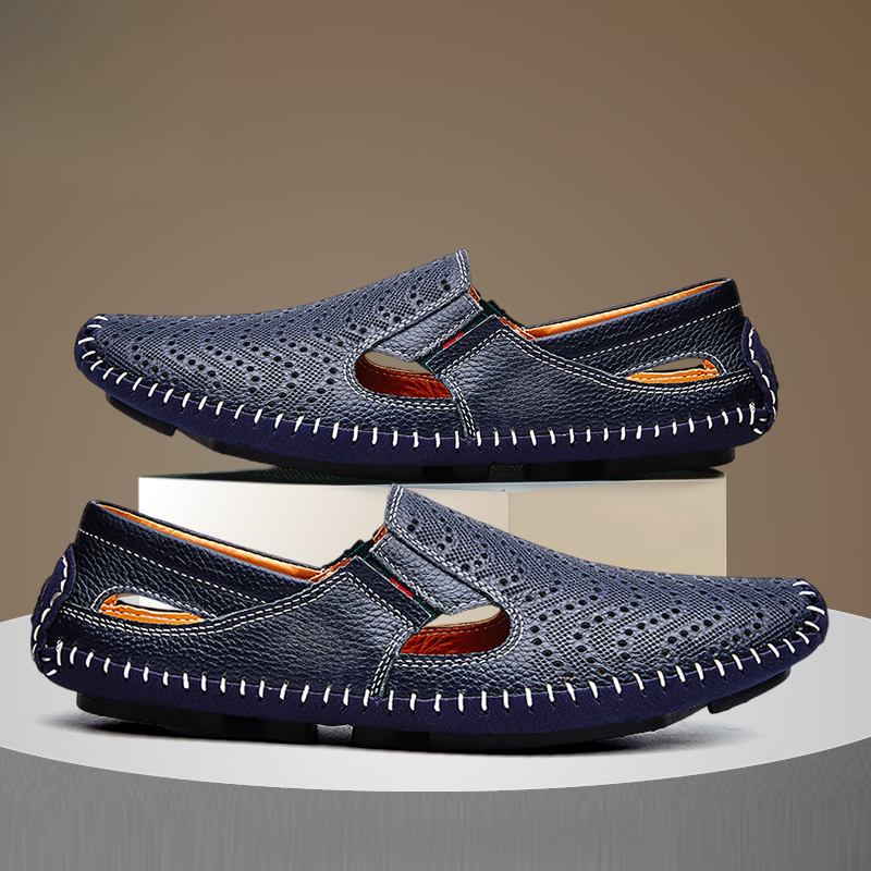 Pair of navy perforated leather sandals with orange lining and stitched trim
