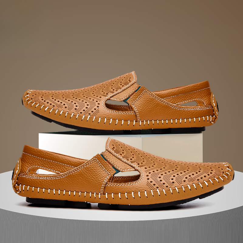 Pair of tan perforated leather sandals with hand-stitched edging and vents