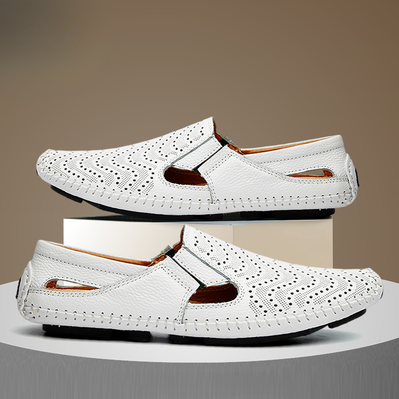 Pair of white perforated leather sandals with contrast stitching and cut-outs