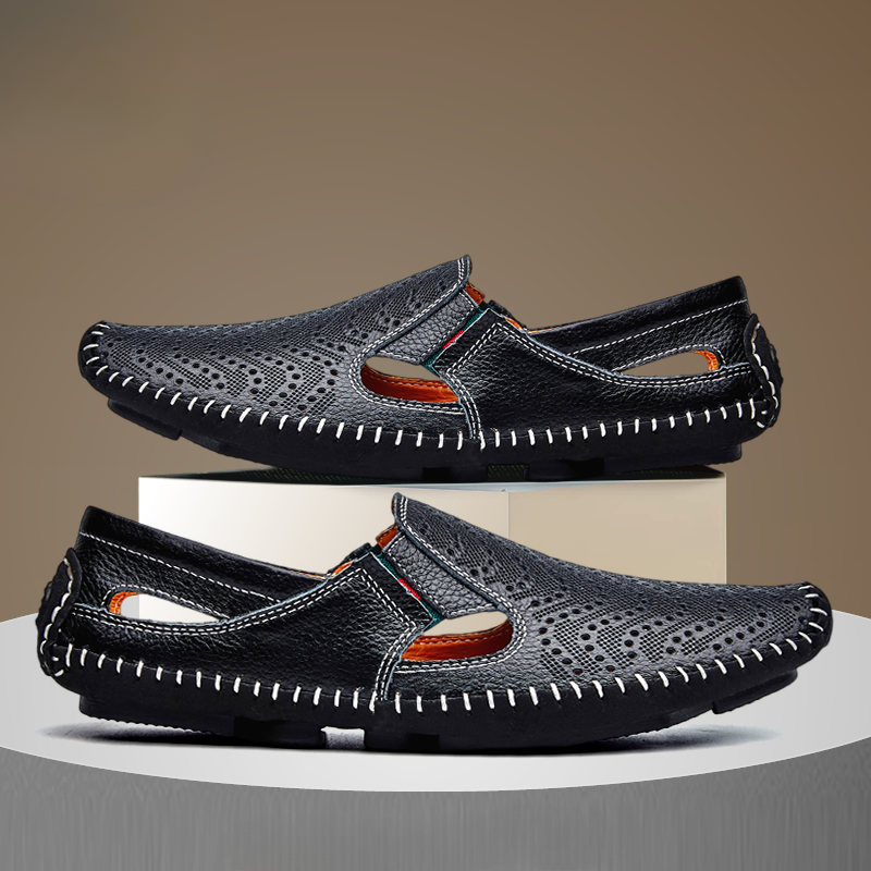 Pair of black perforated leather sandals with orange lining and side vents