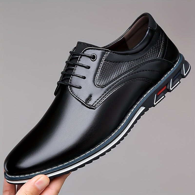 Black leather men's derby shoe held up showing textured side panel