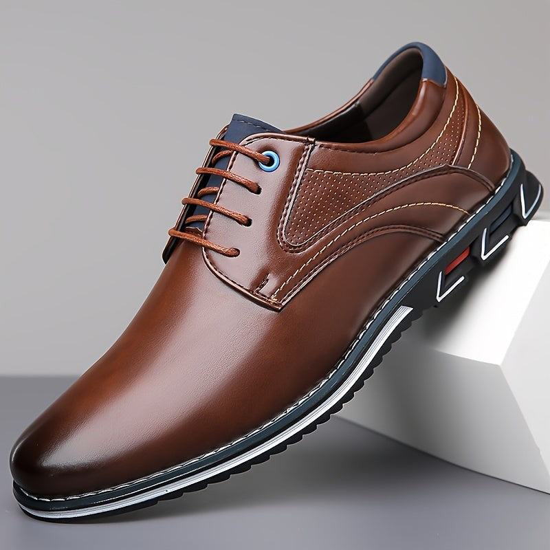 Brown leather lace-up shoe with tan laces and navy heel trim