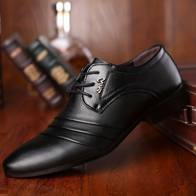 Pair of black formal lace-up shoes with polished leather finish